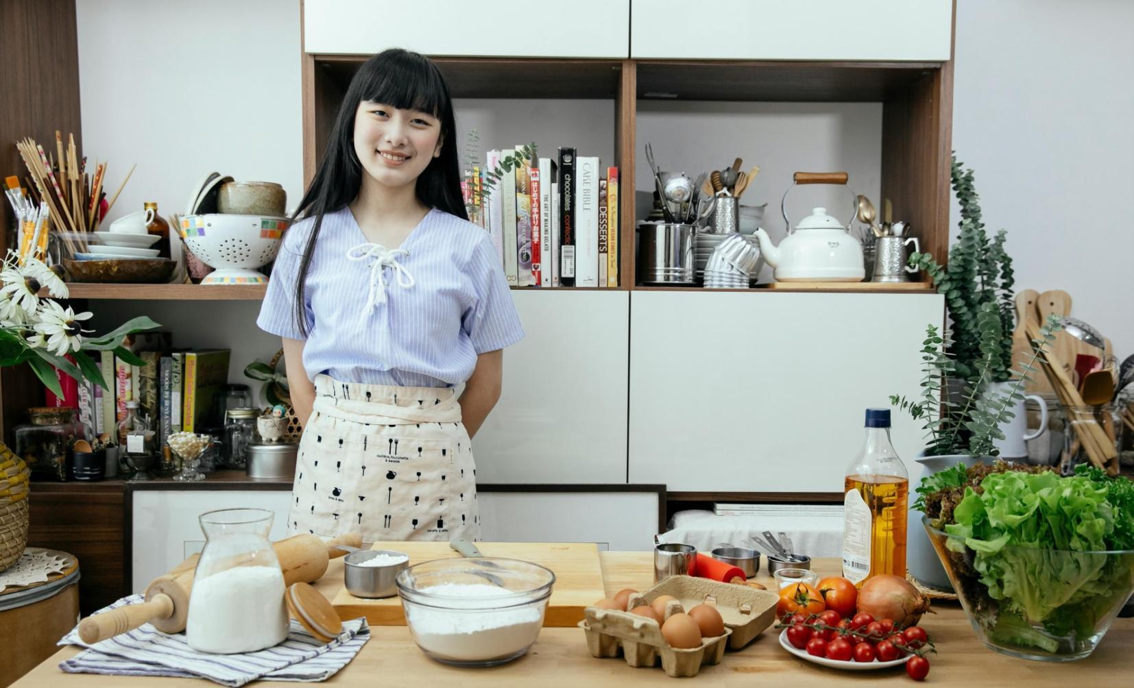 Fresh vegetables and ingredients arranged on wooden cutting board for meal preparation planning